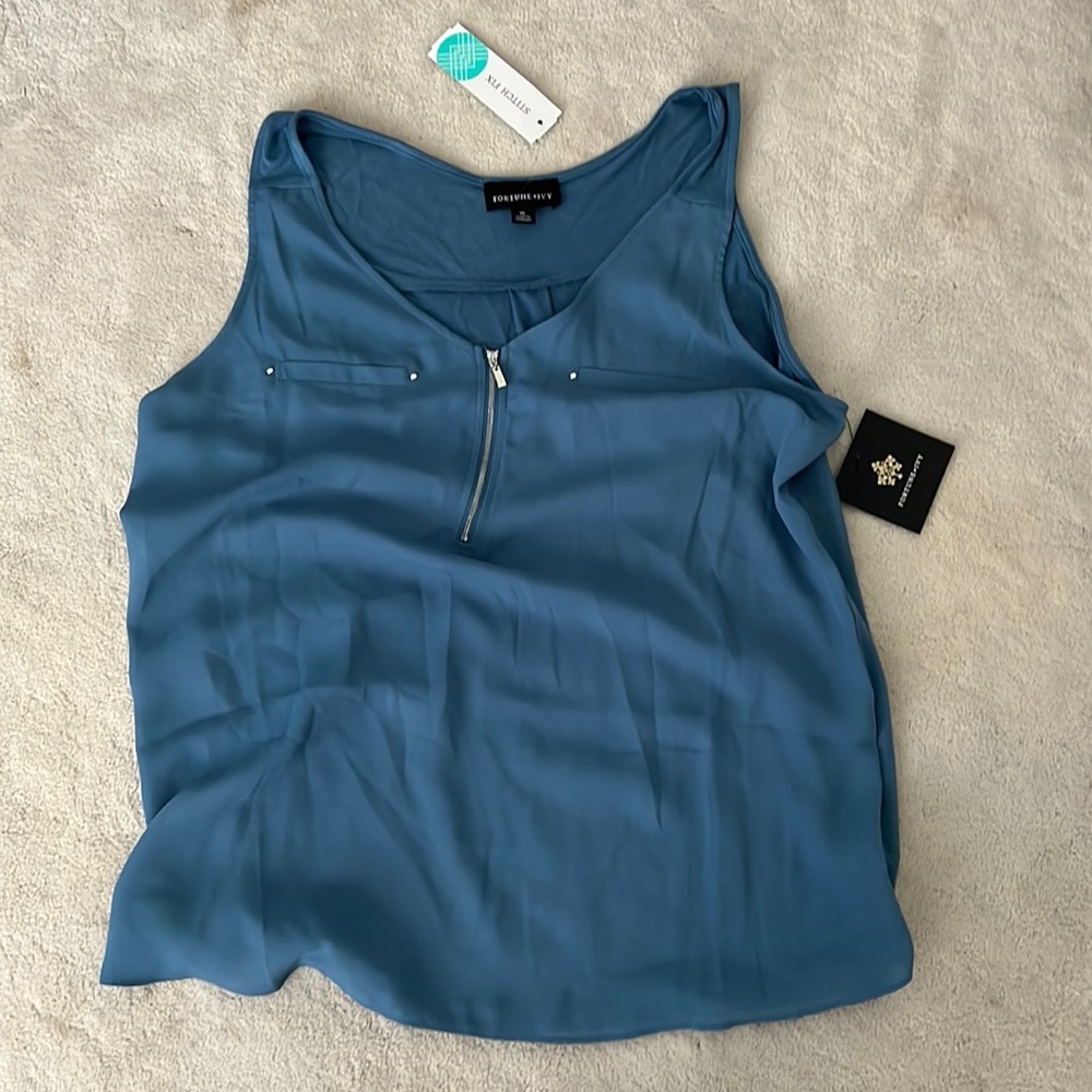 XL blouse. Brand new with tag. Sleeveless.